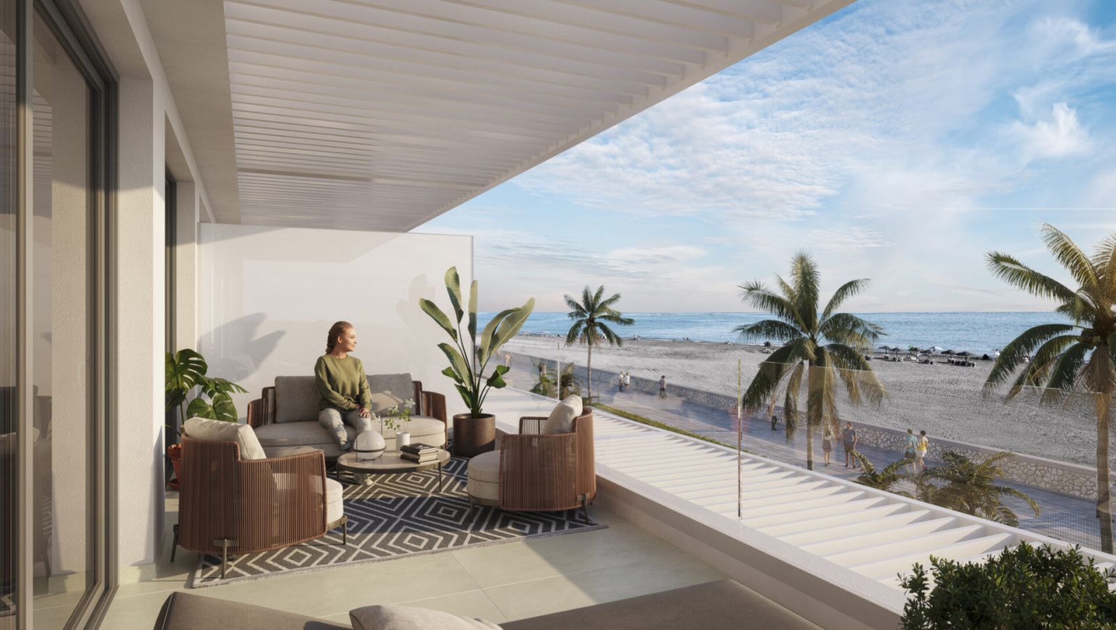 Balcón frente a la playa con zona de estar en La Gloria Playa.